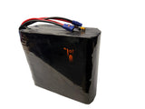 Black battery pack with connectors on a white background